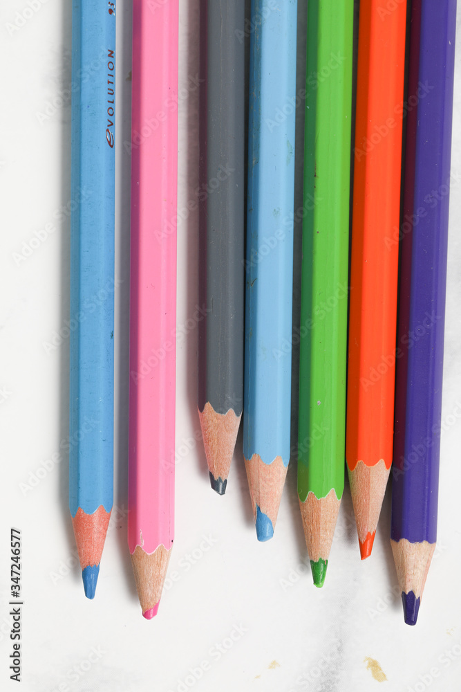 close up of color pencils on white background close up of color pencils on white background
