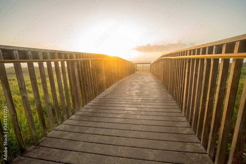 Low Angle View of Sunrise On the Horizon from Beach Board Walk