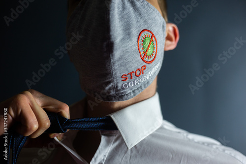 Man in a tie and mask "Stop Coronavirus" 