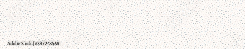 Dense confetti dotty border texture seamless background. Neutral cream flecked sprinkle handmade paper. Mulberry speckle pattern. Japanese minimal recycled ribbon trim banner. Natural washi tape edge