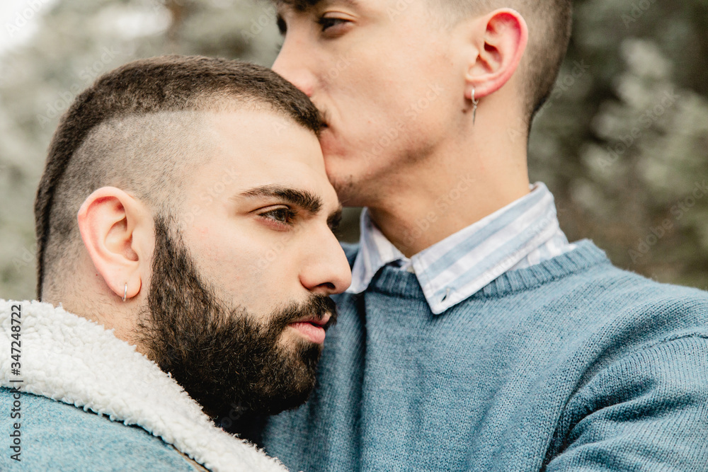 Gay couple in love on a mountain road Gay couple in love on a mountain road