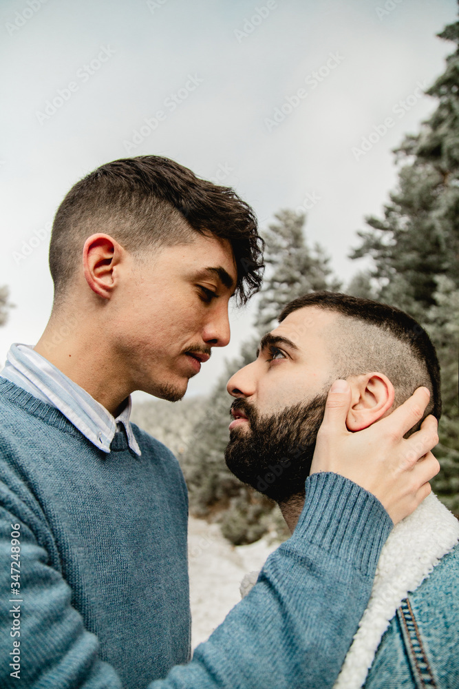 Gay couple in love on a mountain road Gay couple in love on a mountain road