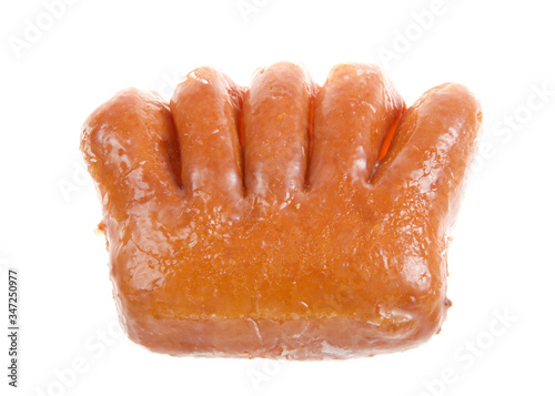 Top view flat lay of one bear claw donut isolated on white. A yeast donut shaped like a bear claw. filled with apple fruit and covered in sugar glaze. photo