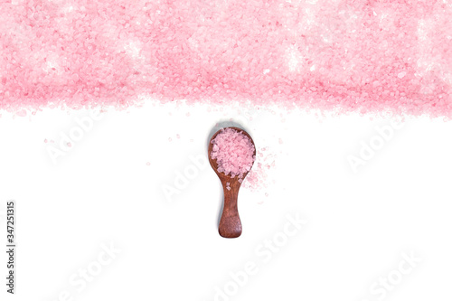 Pink salt isolated in scoop on white background. selective focus or blurry. photo