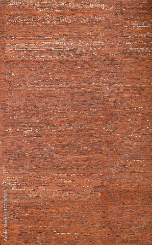Big old red brick wall. Full frame textured background of detailed old and weathered brick wall.
