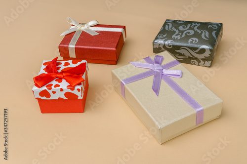 decorative boxes with bows on a light background