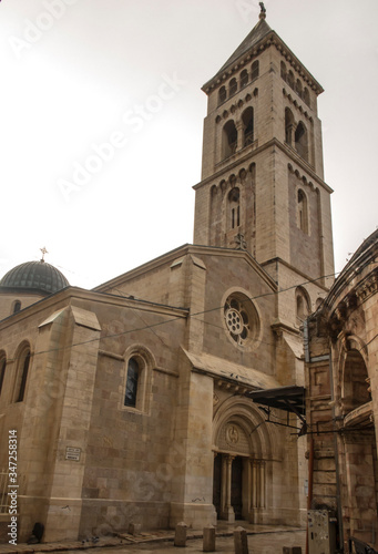 Old City of Jerusalem - Christian Quarter, empty street and square in the morning in rainy weather. Israel