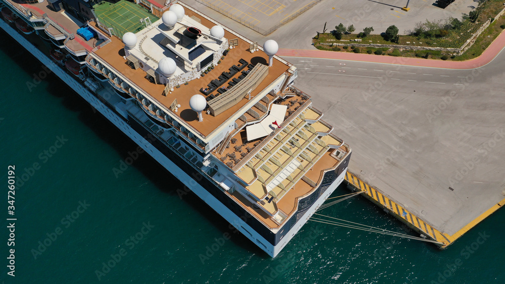 Aerial drone photo of huge luxury cruise liner docked in Mediterranean port