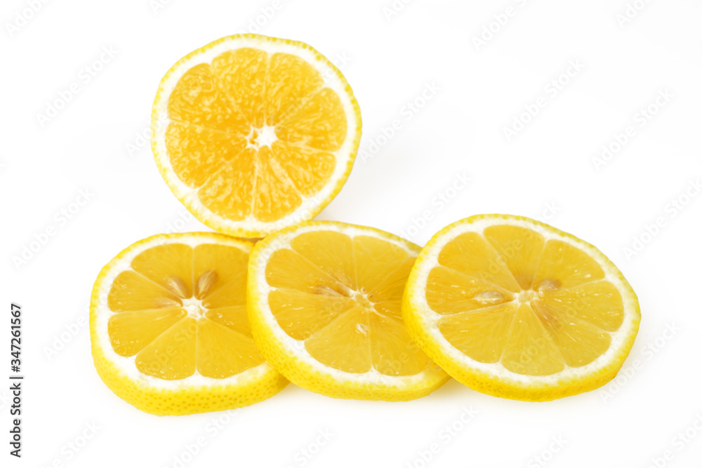 Sliced lemon round slices, white background, macro