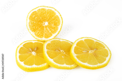 Sliced lemon round slices, white background, macro