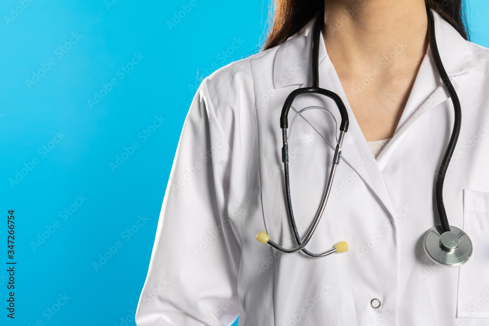 The upper half of the silhouette of the young lady doctor with a stethoscope hung around the neck. The upper half of the silhouette of the young lady doctor with a stethoscope hung around the neck.