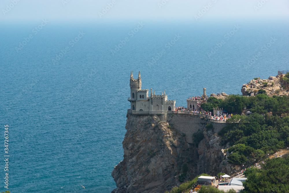 Yalta - July 29, 2016: Monument of architecture and history in the village of Gaspra - Swallow's Nest. Sea horizon, Aurorina rock