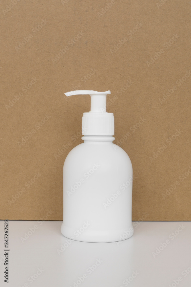 Sanitizer or antiseptic gel to prevent coronavirus disease. Virus protection concept. Pure white bottle on a brown background. Hygiene, the warn of germs and bacteria. Sanitizer or antiseptic gel to prevent coronavirus disease. Virus protection concept. Pure white bottle on a brown background. Hygiene, the warn of germs and bacteria.
