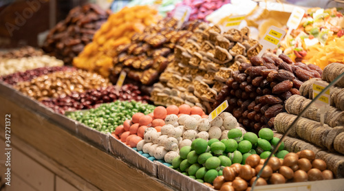 Colorful candies. A photo was taken from the side. Apart from sugar, there is almond content. Close-up.
