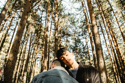 Gay couple in love at the forest © Elsa