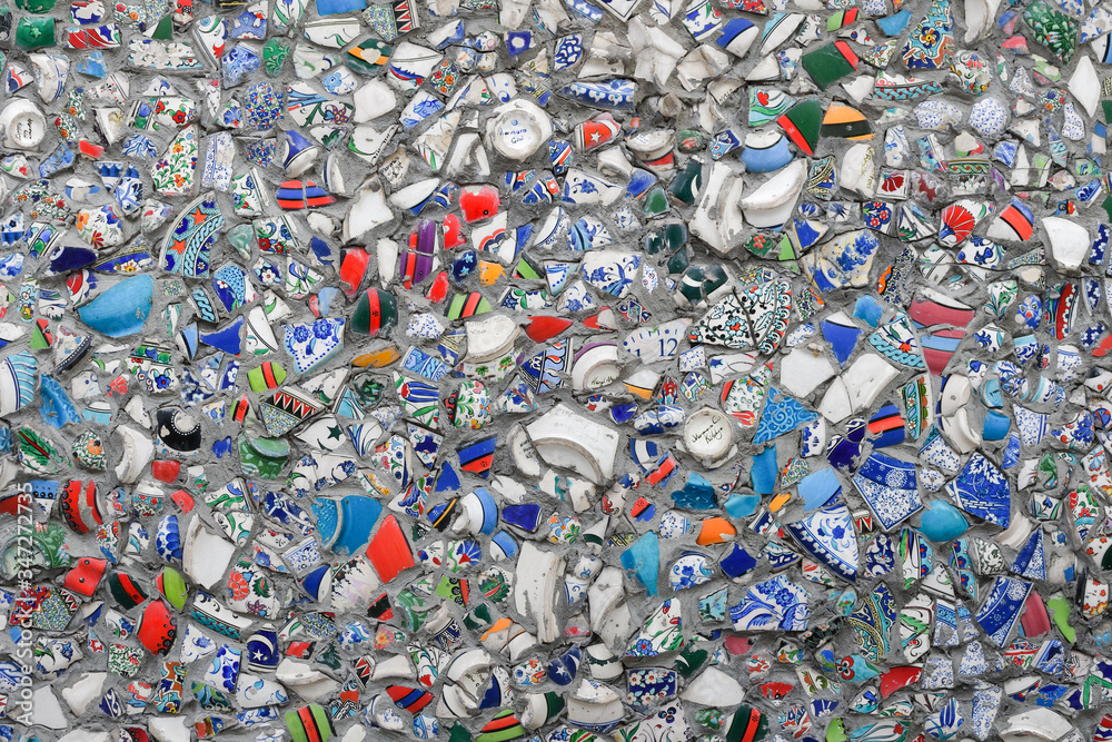 Close up of a wall, decorated with broken pieces of handmade ceramic pots. Close up of a wall, decorated with broken pieces of handmade ceramic pots.