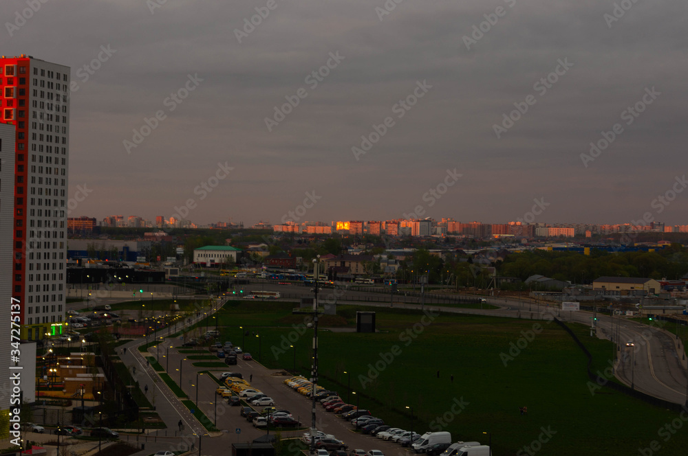 Fototapeta premium new buildings of Moscow city, Salaryevo district at sunset