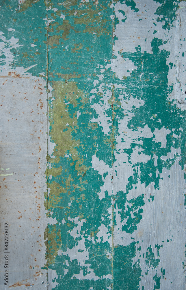 Blue cracked and swollen paint with rust texture. Grunge rusty metal background. Stains of rust. Blue cracked and swollen paint with rust texture. Grunge rusty metal background. Stains of rust.