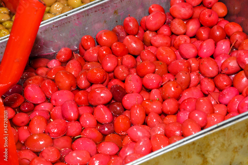 Turkish olives different mix for sale in Grand Bazaar, Egyptian outdoor market. Fresh produce photo