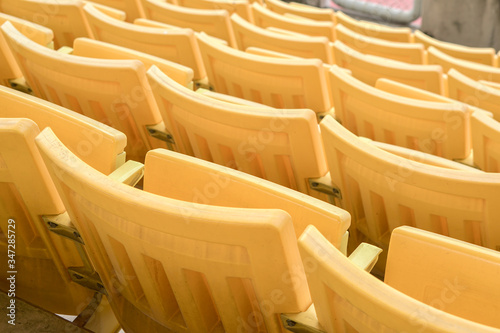 Empty old seat got abandoned in stadium with no spectators due to Covid-19 or Corona Virus affect cancellation of sport tournament