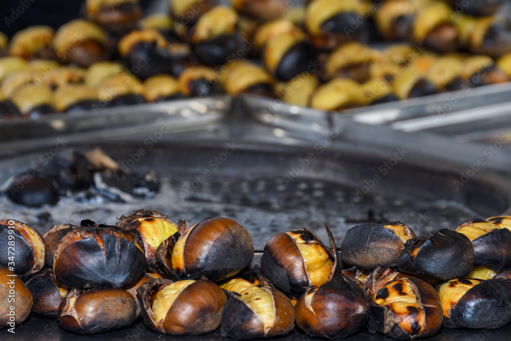 Roasting chestnuts on a street stall in Istanbul, Turkey. Selective focus.