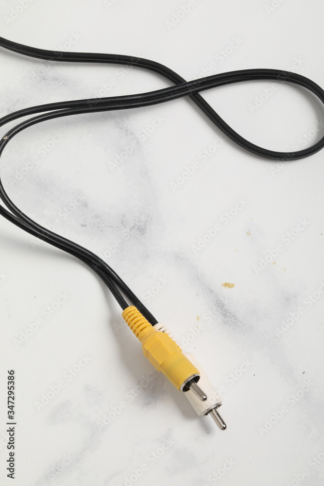 video cable white yellow on white marble background