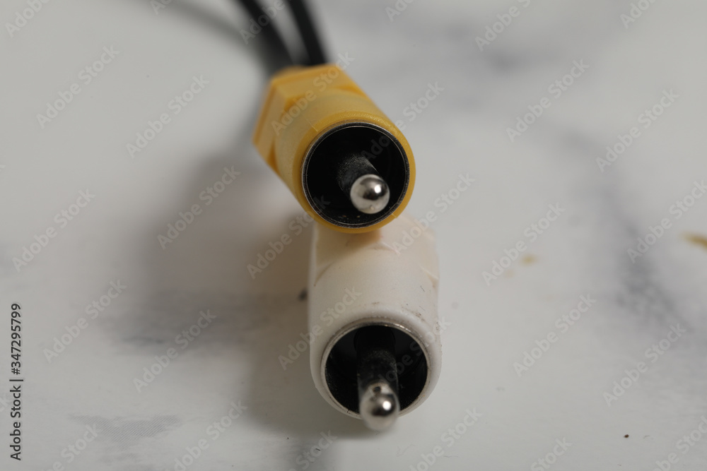 video cable white yellow on white marble background video cable white yellow on white marble background
