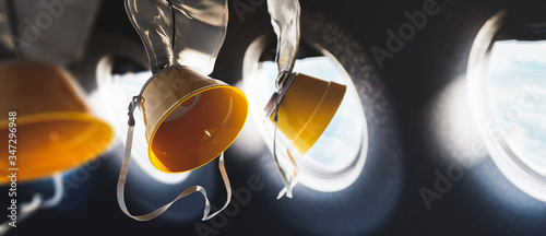 Photo 3D illustration of oxygen masks inside an airplane