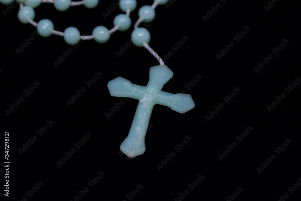 holy rosary isolated on black background, religious concept holy rosary isolated on black background, religious concept