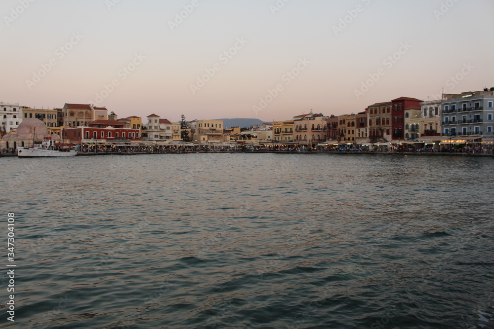 A view of old Venetian Harbor of Chania with historical buildings in Crete Island, Greece.