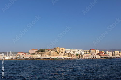 Fototapeta Naklejka Na Ścianę i Meble -  A view of old Venetian Harbor of Chania with historical buildings in Crete Island, Greece.