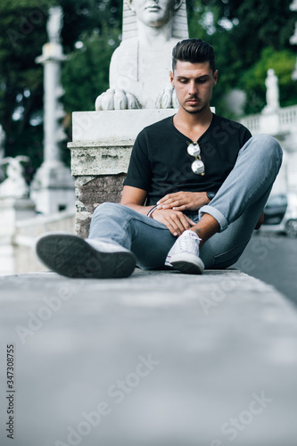 Nice boy posing in Rome during a sunny day untile the sunset photo