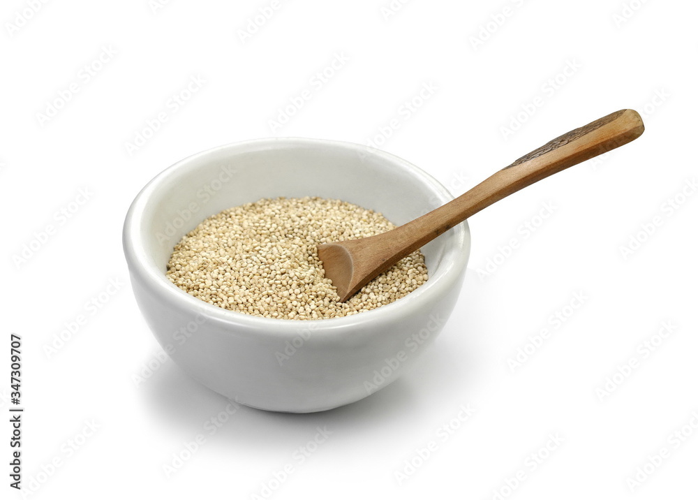 Organic Quinoa (Chenopodium quinoa) seeds in a white bowl with wooden spoon isolated on white background. Macro close up. Top view. quinoa seeds isolated on white background. Organic Quinoa (Chenopodium quinoa) seeds in a white bowl with wooden spoon isolated on white background. Macro close up. Top view. quinoa seeds isolated on white background.