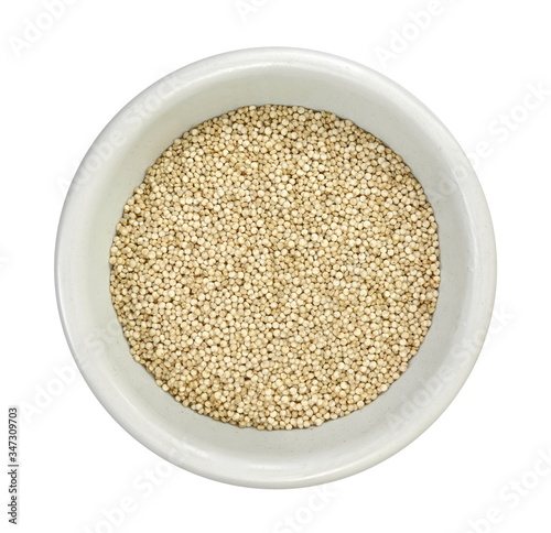 Organic Quinoa (Chenopodium quinoa) seeds in a white bowl isolated on white background. Macro close up. Top view. quinoa seeds isolated on white background.