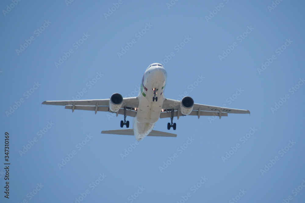 TAP Air Portugal Airbus A319 flying in Lisbon