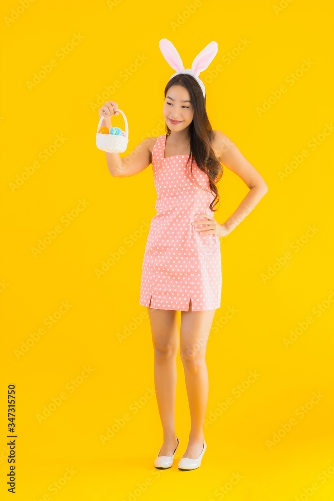 Portrait beautiful young asian woman with bunny ears with easter eggs Portrait beautiful young asian woman with bunny ears with easter eggs