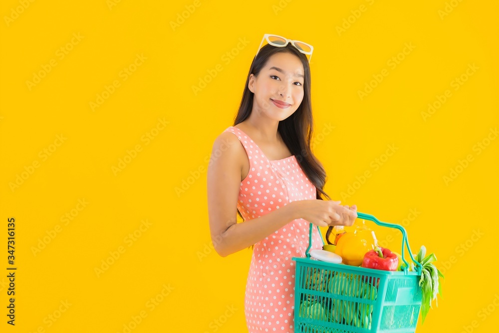 Portrait beautiful young asian woman with grocery in basket shopping from supermarket Portrait beautiful young asian woman with grocery in basket shopping from supermarket