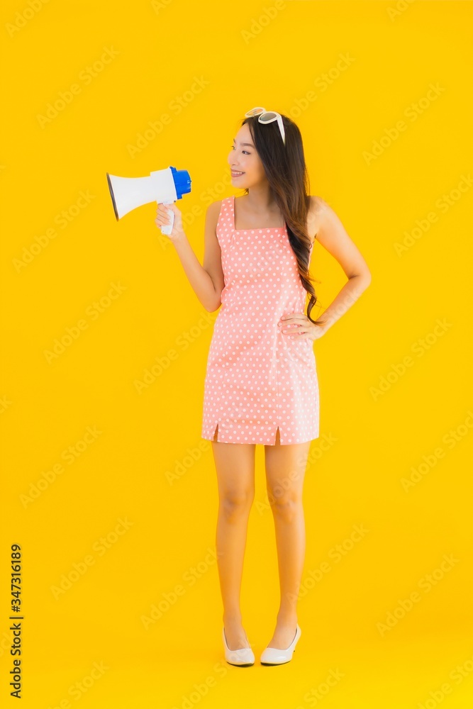 Portrait beautiful young asian woman speak loud with megaphone