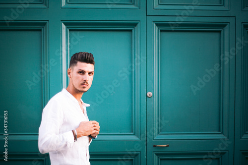 Nice boy posing in Rome during a sunny day untile the sunset photo