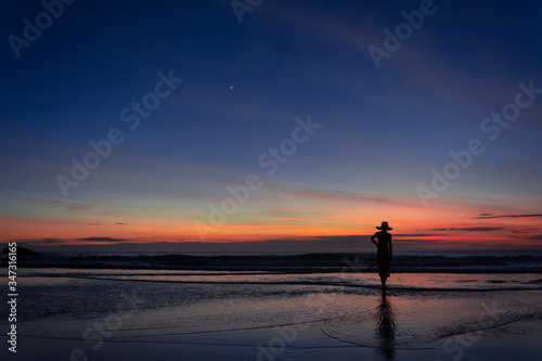 silhouette of man walking on the beach at sunset, Ilha do Mel - Paran-a - Brazil, January 2020