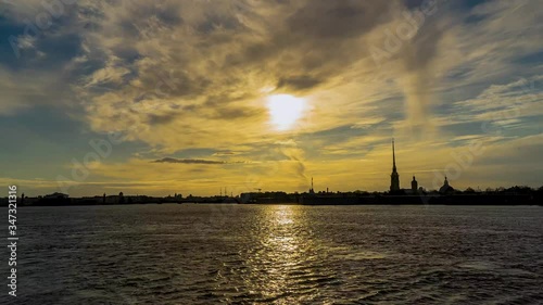 Russia, Saint Petersburg, Peter and Paul fortress and the Neva river at sunset in spring. Urban landscape. Time Lapse. photo