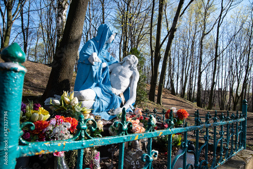 
Religious sculpture showing the figure of Mary holding Jesus after being removed from the cross in the park.