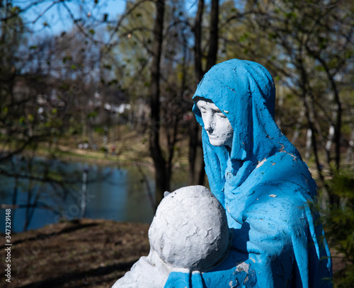 
Religious sculpture showing the figure of Mary holding Jesus after being removed from the cross in the park.