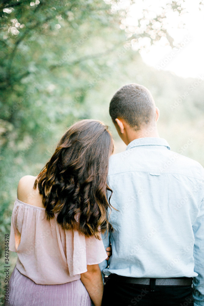 Romance. Couple in love. The girl bowed her head on the shoulder of her beloved. Date. Love. Relationship. Romance. Couple in love. The girl bowed her head on the shoulder of her beloved. Date. Love. Relationship.