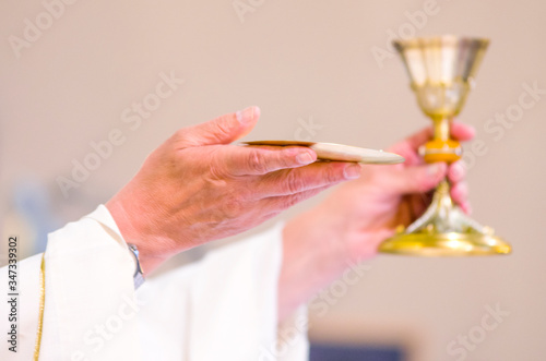 chalice with wine, blood of christ, and pyx with bread, body of christ, ready for the communion of the faithful