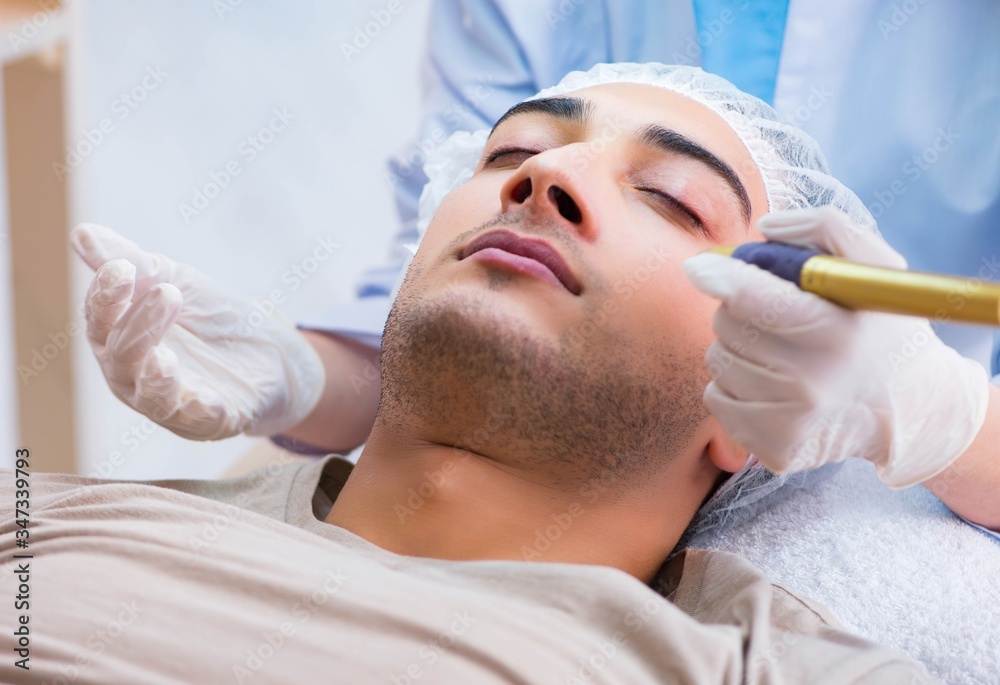 Man visiting dermatologyst for laser scar removal