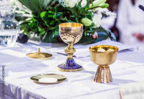 altar with host and chalice with wine in the churches of the pope of rome, francesco