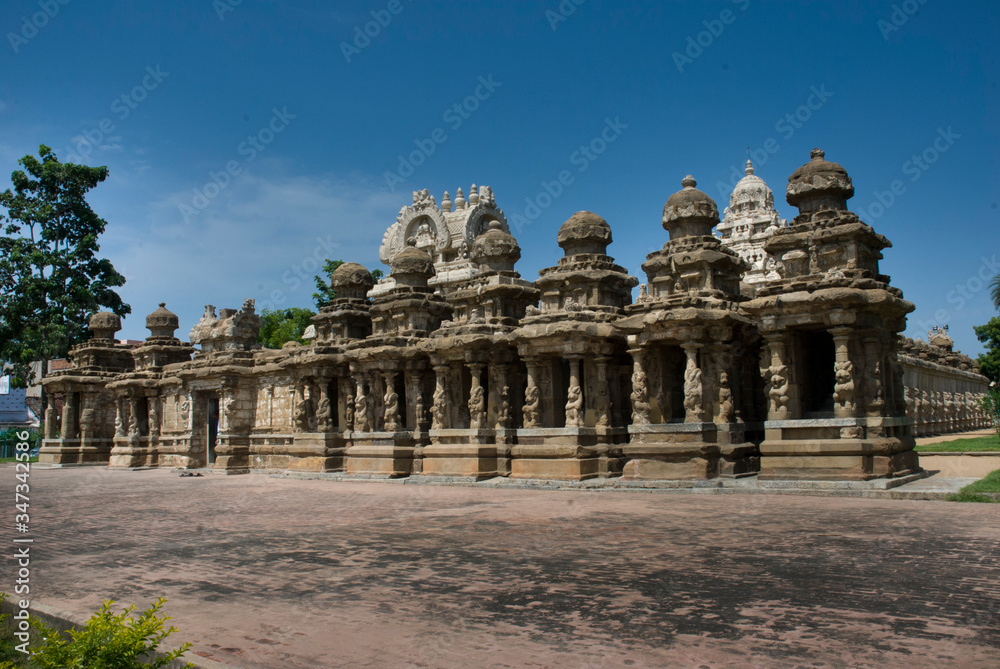 KANCHIPURAM TAMILNADU / INDIA  SEP 11 2011 front view of kailasanathar temple, where rows of small mandapams with gopuram in front of main gopuram which is partly  visible.