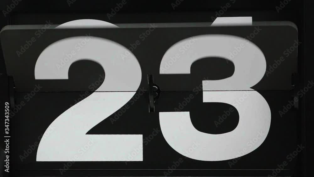 Close-up Slow Motion Flip clock the days of the month from 23 to 24, Time concept. Close-up Slow Motion Flip clock the days of the month from 23 to 24, Time concept.