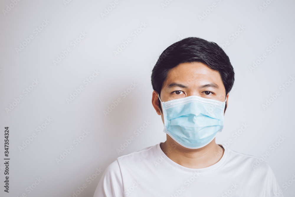 studio picture from a young man sneeze. Sick guy isolated has runny nose. man makes a cure for the common cold.copy space studio picture from a young man sneeze. Sick guy isolated has runny nose. man makes a cure for the common cold.copy space